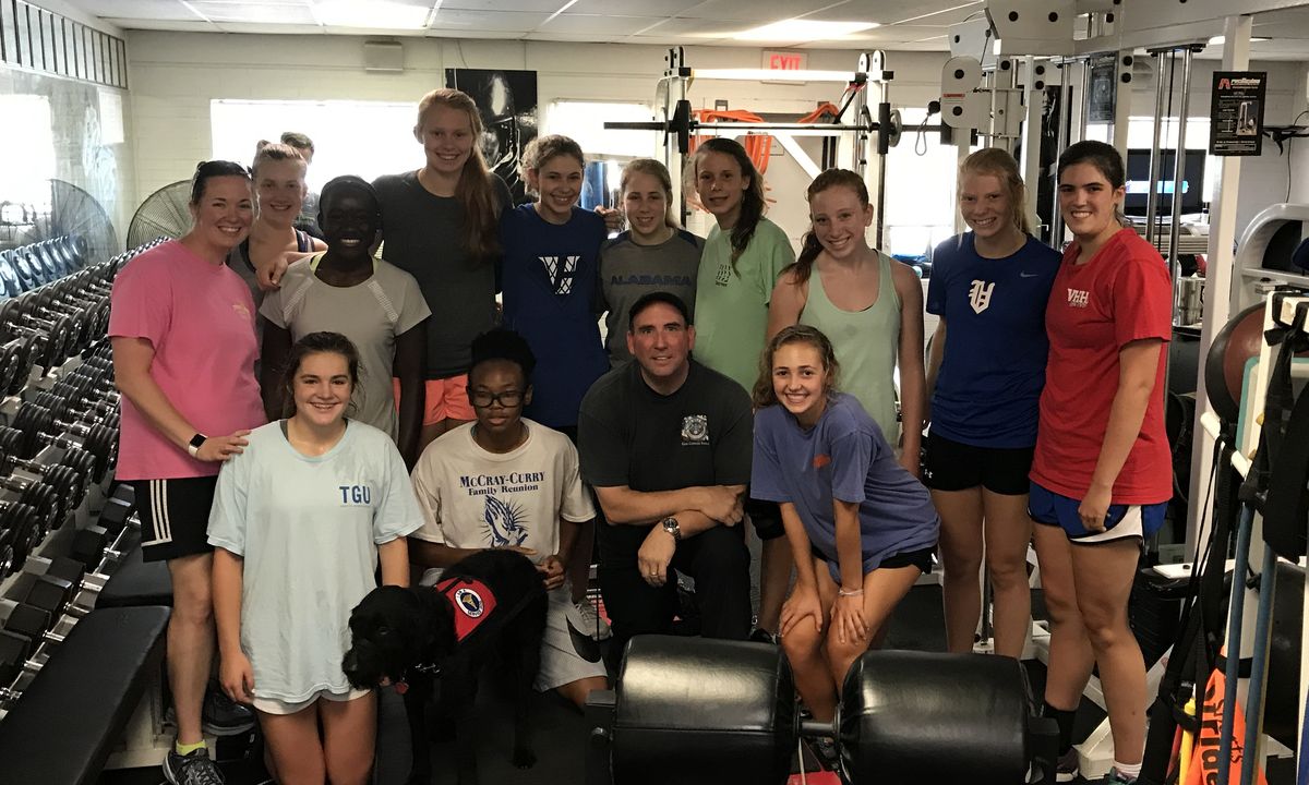 Team athletes with their coach at Icon Performance