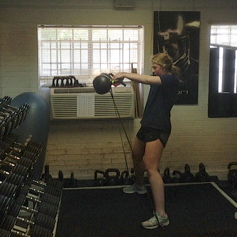 Athlete training with a kettlebell