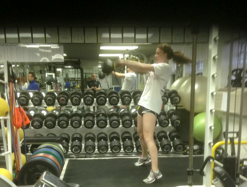 Athlete doing rotational medicine ball work