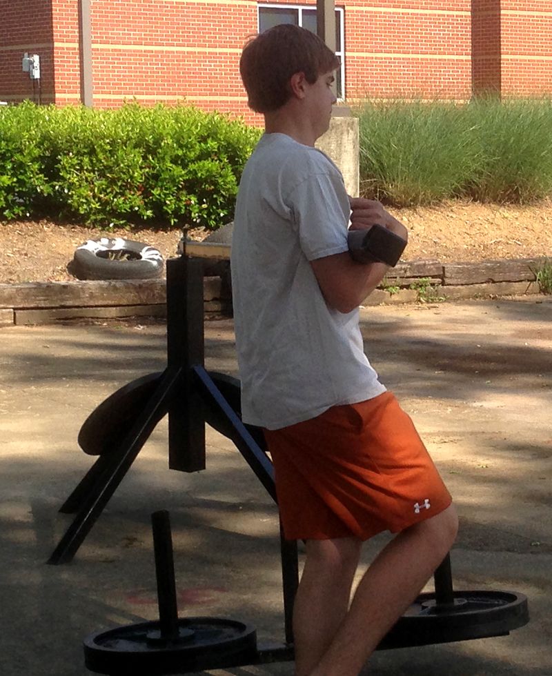 Teen athlete with outdoor training equipment